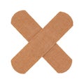 Cross of two brown adhesive bandage, medical sticking plasters isolated on white Royalty Free Stock Photo