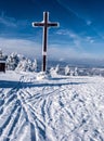 Cross on Velka Raca hill in winter Kysucke Beskydy mountains on slovakian - polish borders