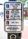 Cross walk sign with instructions on crossing the street. in Kirkwood Missouri