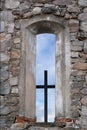 Cross in window of ancient stone church Royalty Free Stock Photo