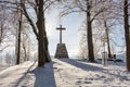 Cross in the winter forest. Christian cross in the snowy forest