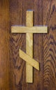 Cross on a wooden background. wood texture
