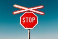 Crossbuck and stop sign on countryside road and railway intersection Royalty Free Stock Photo