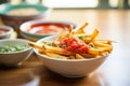 crosscut fries with ketchup in a dipping bowl