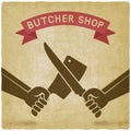 Crossed butcher knives old background