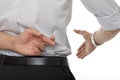 Crossed fingers at handshake Royalty Free Stock Photo