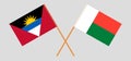 Crossed flags of Antigua and Barbuda and Madagascar