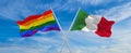 crossed flags of lgbt and Italia flag waving in the wind at cloudy sky. Freedom and love concept. Pride month. activism, community