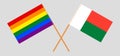 Crossed flags of LGBT and Madagascar