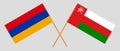 Crossed flags of Oman and Armenia