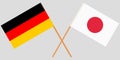 The crossed Japan and Germany flags. Official colors. Vector