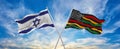 crossed national flags of Israel and Black history month USA flag waving in the wind at cloudy sky. Symbolizing relationship, Royalty Free Stock Photo