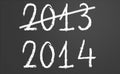 2013 crossed and new year 2014 on chalkboard