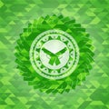 Crossed pistols icon inside green emblem with mosaic ecological style background