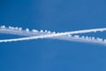 Crossed traces of planes in the clear blue sky Royalty Free Stock Photo