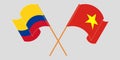 Crossed and waving flags of Colombia and Vietnam
