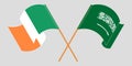 Crossed and waving flags of Ireland and the Kingdom of Saudi Arabia