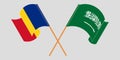 Crossed and waving flags of Romania and the Kingdom of Saudi Arabia