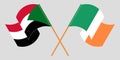 Crossed and waving flags of Sudan and Ireland