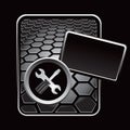 Crossed wrench and screwdriver on black hexagon ad Royalty Free Stock Photo