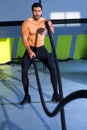 Crossfit battling ropes at gym workout exercise