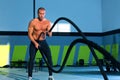 Crossfit battling ropes at gym workout exercise Royalty Free Stock Photo