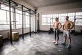 Crossfit couple posing with hands on hips Royalty Free Stock Photo