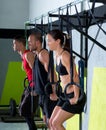 Crossfit dip ring group workout dipping in a row Royalty Free Stock Photo