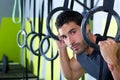 Crossfit dip ring man relaxed after workout at gym