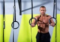 Crossfit dip ring man relaxed after workout at gym