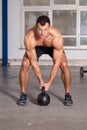 Crossfit - kettlebell training man in a gym