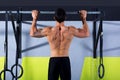 Crossfit toes to bar man pull-ups 2 bars workout Royalty Free Stock Photo