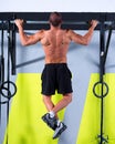 Crossfit toes to bar man pull-ups 2 bars workout Royalty Free Stock Photo