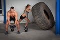 Crossfit training - woman flipping tire Royalty Free Stock Photo