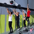 Crossfit workout people group with wall balls and rope Royalty Free Stock Photo