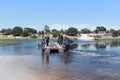 crossing the boteti river by car and passenger ferry in makgadikgadi pans national park, botswana Royalty Free Stock Photo