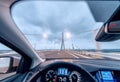 Crossing the bridge with a modern car, cockpit view Royalty Free Stock Photo