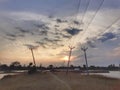 Crossing electric posts , lines with. Sunset. Royalty Free Stock Photo