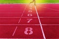 Crossing finish line on athletics,red running track Royalty Free Stock Photo