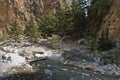 Crossing over mountain river at rocky terrain of Samaria gorge, south west part of Crete island Royalty Free Stock Photo