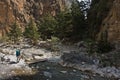 Crossing over mountain river at rocky terrain of Samaria gorge, south west part of Crete island Royalty Free Stock Photo