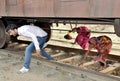 Crossing the railway line under the goods train