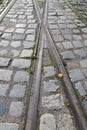 Crossing the tram tracks in the pavement Royalty Free Stock Photo