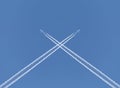 Crossing of two aircraft traces Royalty Free Stock Photo