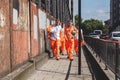 Crossrail construction workers walking along the street, London