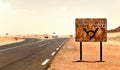 Crossroads in the desert, an asphalt road in the Sahara Desert road to Libya and Nigeria, Djanet, Algeria, Africa Royalty Free Stock Photo