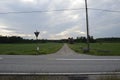 Crossroads of dirt and asphalt roads somewhere in Finland