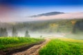 Crossroads in the morning mist in mountains