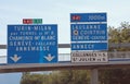Crossroads of the motorway with directions to reach the cities o Royalty Free Stock Photo