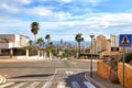 Crossroads with panoramic views of Benidorm with skyscrapers and the sea on the horizon on a sunny day, Spain